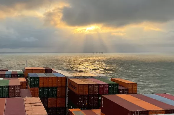 Cargo ship pilot photo sun in clouds