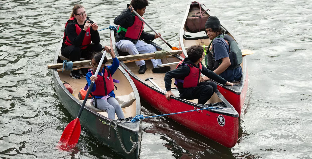 Children in boats at Shadwell Basin