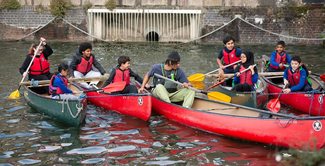 Children in boats at Shadwell Basin