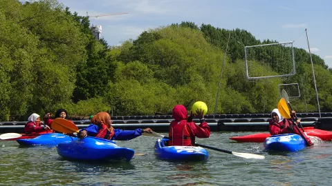 Phoenix Canoe Club participants playing polo in canoes in 2022